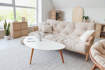 Interior of stylish living room with white sofa and coffee table