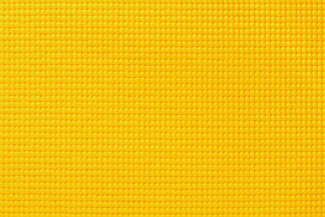 Yellow color yoga mat texture, pattern of rubber for background.
