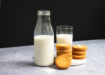 Homemade butter cookies, Breton style, with fresh milk, on a dark background..Copy space.