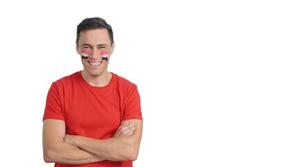 Man standing with egyptian flag painted on face smiling