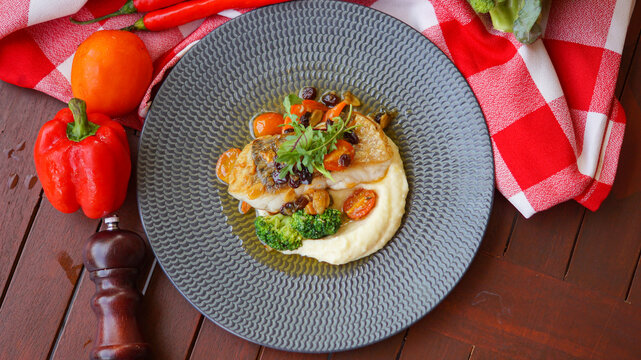 fish steak served on a plate