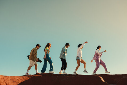 Group of friends traveling together, enjoying youth and adventure with copy space