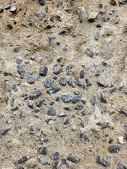 Rough stone on cement floor background