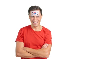 Man standing with south korean flag painted on face smiling