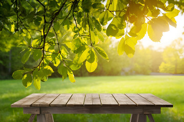 Naklejka premium Spring summer beautiful natural background with green foliage in sunlight and empty wooden table outdoors. Abstract backgrounds wallpaper. Ai generative