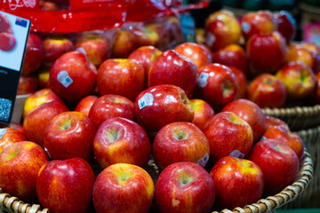 Nonthaburi, Thailand - June 18, 2024: Many red apple in baskets for sale in the supermarket 
