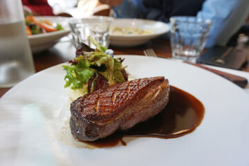 Close up roasted BBQ duck breast served with balsamic sauce and mashed potato