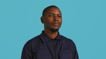 Headshot portrait of security guard at work smiling and overseeing premises. Joyful private law...