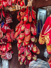 Traditional Tibetan embroidered shoes sold at an street store