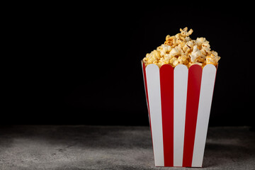 Popcorn box. Red and white striped buckets of popcorn on background. Cinema and entertainment...