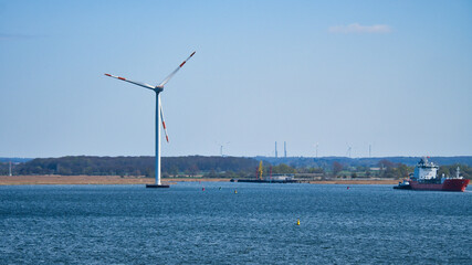 Offshore wind turbine in the sea, on the coast. Green energy of the future. Energy
