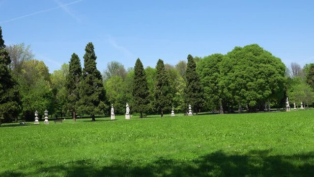 Parco Querini is green area of city of Vicenza, Italy. Monopteros is circular colonnade supporting roof but without any walls. Unlike tholos, it does not have walls making cella or room inside.