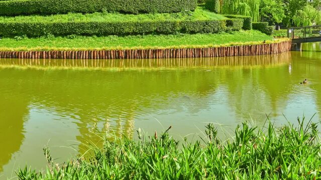 Parco Querini is green area of city of Vicenza, Italy. Monopteros is circular colonnade supporting roof but without any walls. Unlike tholos, it does not have walls making cella or room inside.