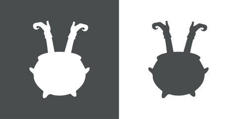 Logo Halloween. Silueta de piernas de bruja con botas y medias en el interior de un caldero de bruja para tarjetas y felicitaciones © teracreonte