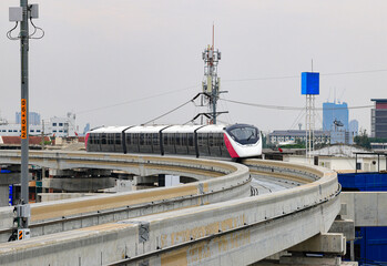The pink monorail Mass Transit System serving in the Metropolitan Region.