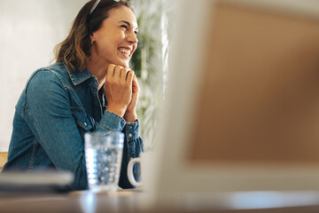 Productive businesswoman participating in an online meeting