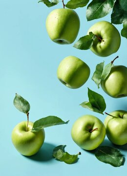 Lavitation of many fresh organic apples on the branch on blue background, apples background. Vegetarian food concept