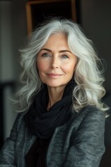 Fototapeta premium A sophisticated senior woman with elegant silver hair and a confident smile, exuding grace and life experience