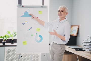 Photo of happy smiling senior lady assistant wear formal shirt participating conference indoors...