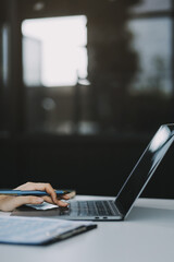 Businesswoman working at office with documents on desk, doing planning analyzing the financial report, Asian woman business plan investment, finance analysis concept