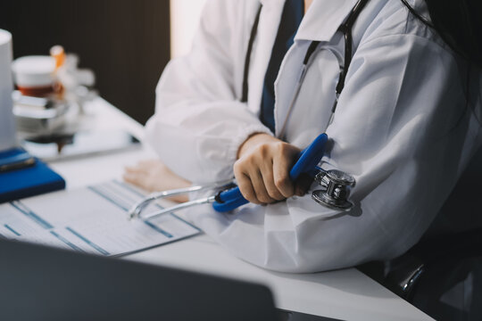Photographic image of doctor holding stethoscope