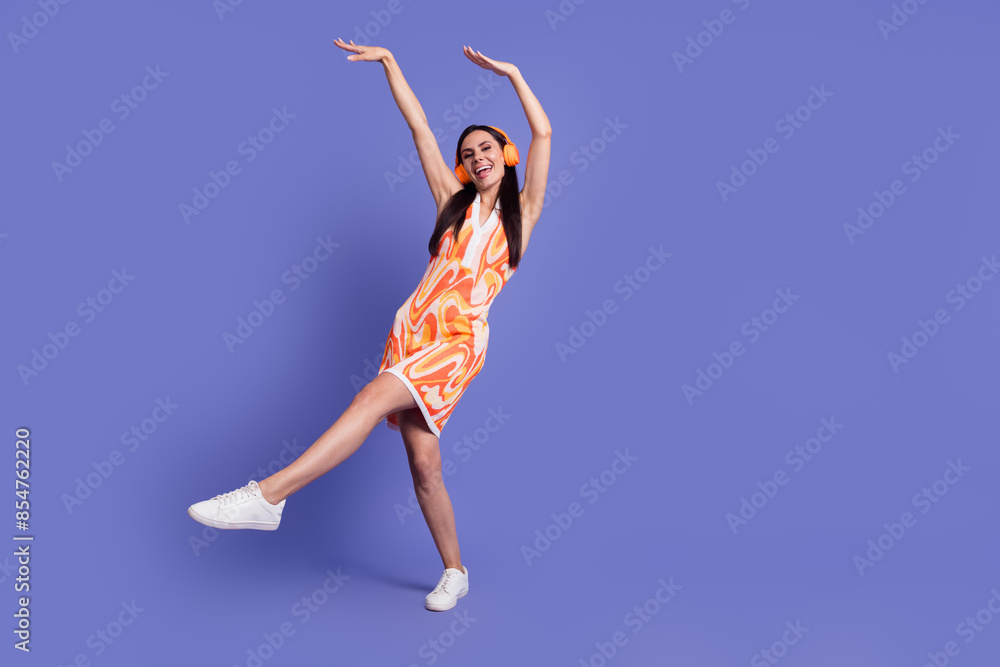 Sticker Full length photo of good mood positive lady wear dress earphones having fun emtpy space isolated purple color background