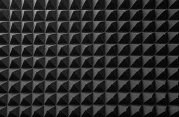 Black acoustic foam as an abstract background.