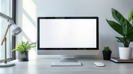 Fototapeta premium Close up Minimalistic workspace with computer modern designer desktop with blank computer screen, office equipment decorations on table. Mock up