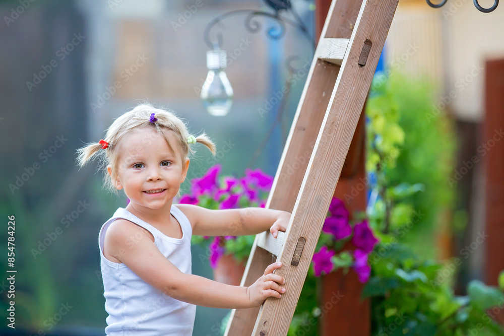 Canvas Prints Cute portrait of a sweet blond toddler child in garden