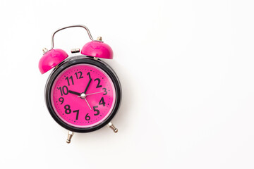 Alarm clock isolated on white background, top view. Copy space.