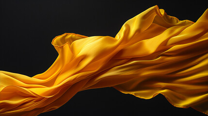 Yellow robe of a Buddhist monk silk on black background, Silk Flowing with mysterious mood.