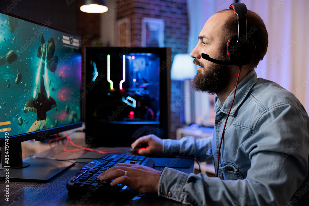 Poster gamer playing classic arcade space shooter videogame, shooting asteroid using lazer beams. man relax