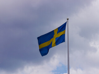 Low angle view of flag against sky