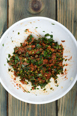 Gremolata seasoning made from finely chopped parsley, crushed garlic, sun-dried tomatoes and mint leaves.