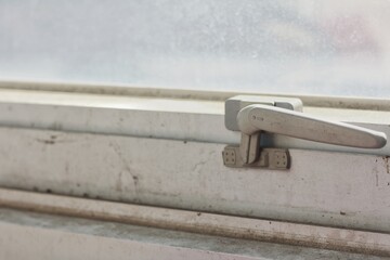 aluminum window locks. Handle with a lock on the window.