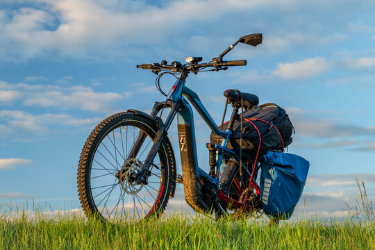 Sunset color evening with bike near path and meadow near Kremze CZ 06 14 2024
