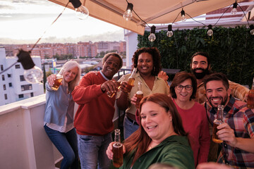 Party on the terrace with a diverse group of friends and having a good time. Concept: Fun, bond
