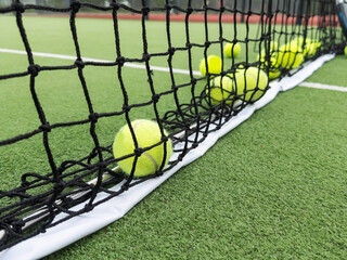 rackets and paddle balls on a court ready to play