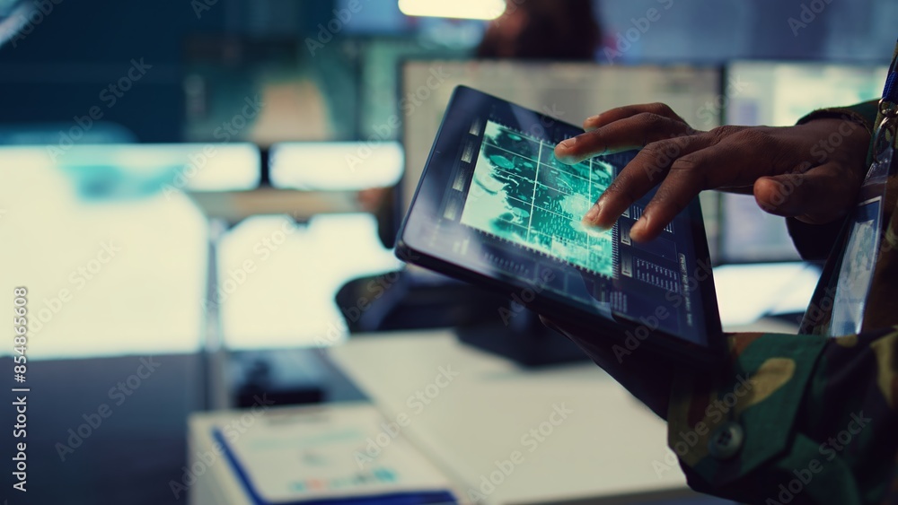 Poster military it professional gathers intelligence from world map projection, tablet connected to satelli