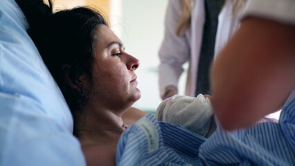 Mother Trembling with Pain After Giving Birth, Surrounded by Caring Medical Team in Maternity...