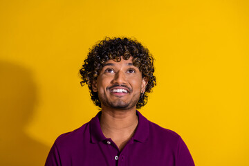 Fototapeta premium Photo portrait of handsome young man look up empty space dressed stylish violet garment isolated on yellow color background