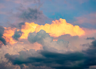 Vibrant sunset clouds over tranquil evening sky in countryside landscape