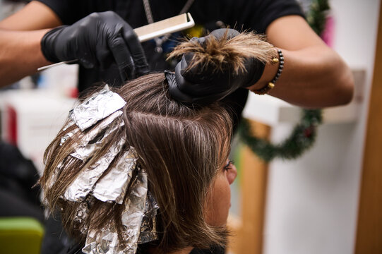 Hair coloring and highlights in modern beauty salon