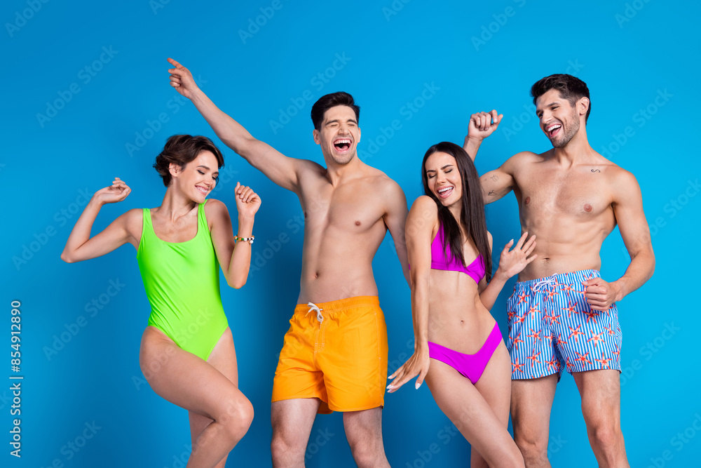 Poster Photo of cheerful carefree fellows company wear swimsuits dancing having fun isolated blue color background