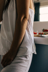 Beautiful woman in the kitchen preparing food. 