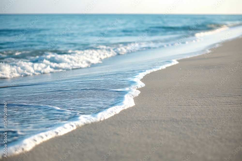 Poster tranquil sandy beach scene with gentle waves lapping at the shore under a soft gradient twilight sky