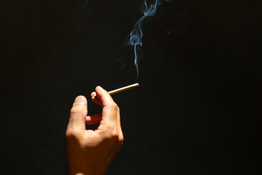 FILE--Passengers Smoke Cigarettes In A Smoking Area At The Terminal 3 Of The Beijing Capital International Airport In Beijing, China, 1 June 2015 Stock Photo