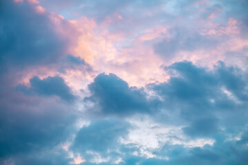 Beautiful clouds in the sky at sunset, pink and blue, natural background, romance, magic