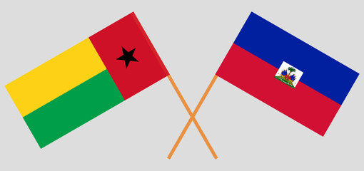 Crossed flags of Guinea-Bissau and Haiti. Official colors. Correct proportion
