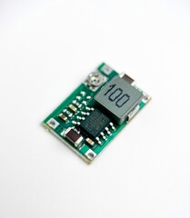 Small step down mini converter circuit electronic part object isolated on white background photography.